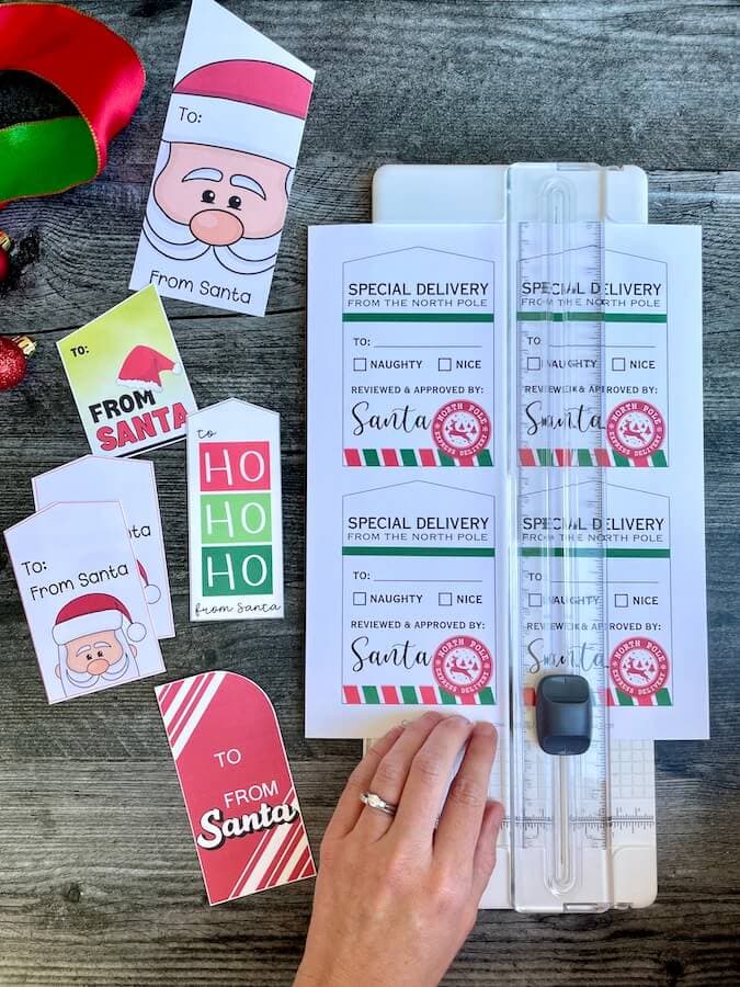 using a paper trimmer to cut out gift tags