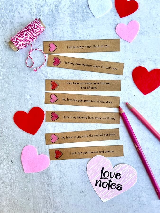 love notes on tan colored paper with hearts
