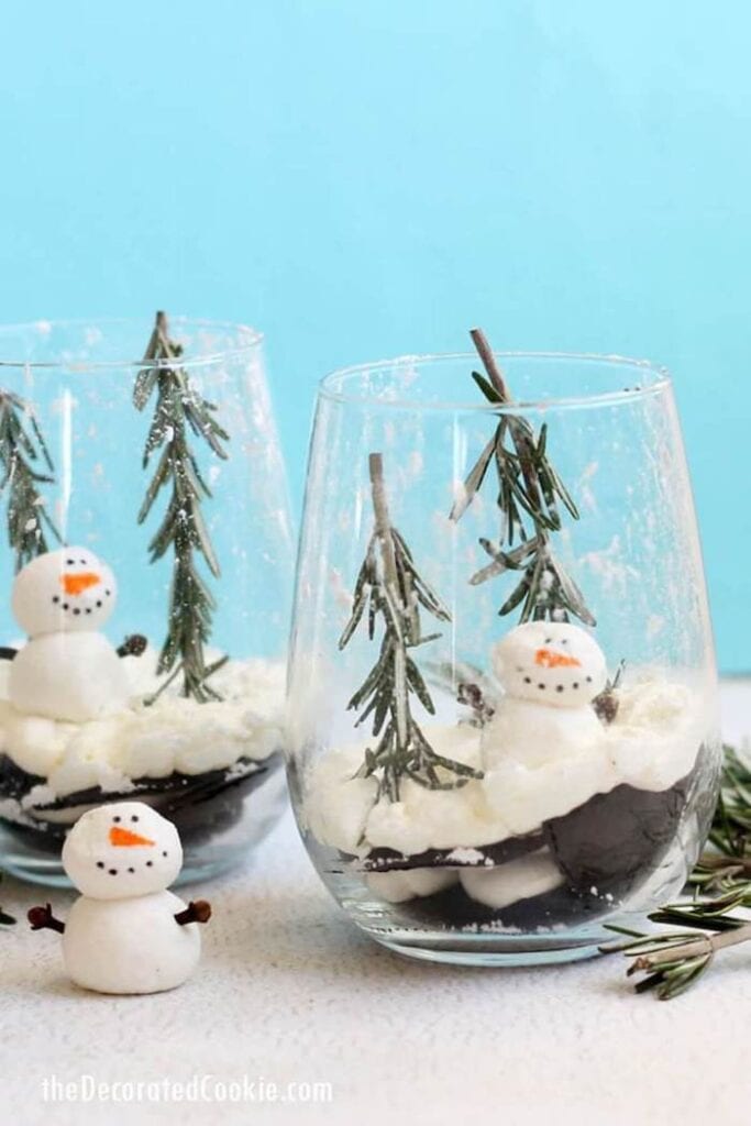 snow globe icebox cake dessert in a glass with mini snowmen