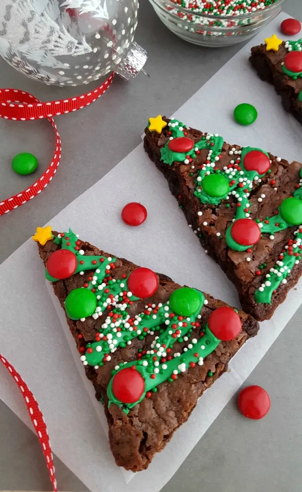 triangular brownies decorated with icing and candy