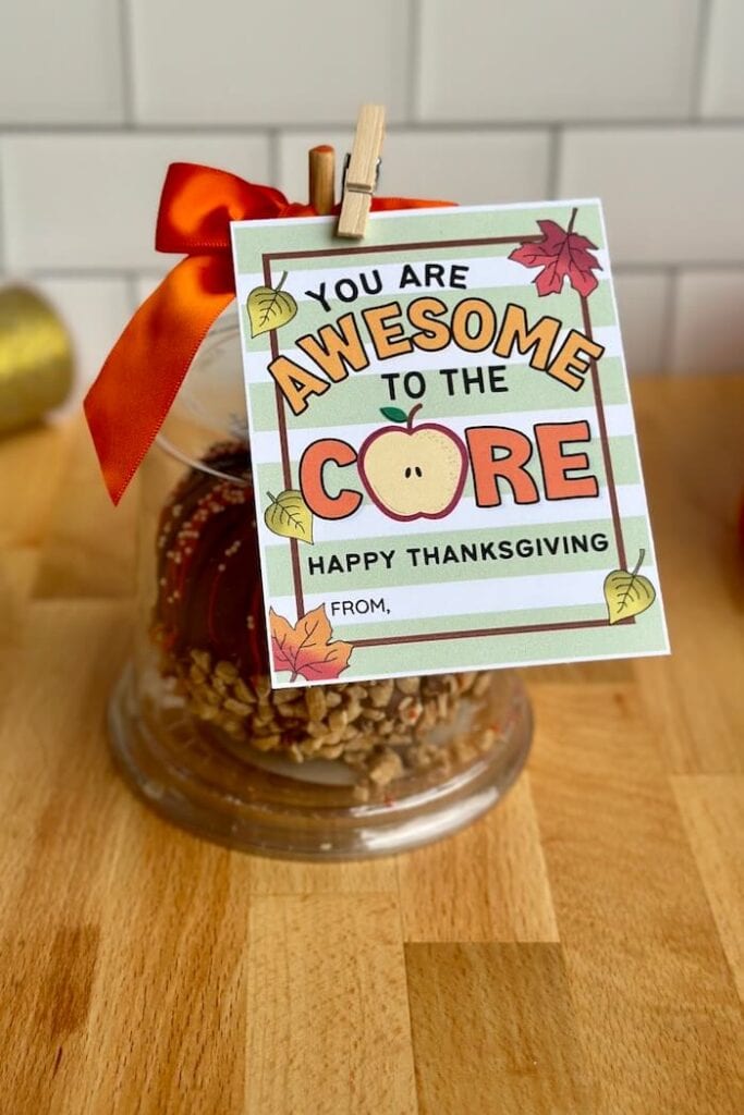 printable gift tag that says you are awesome to the core tied on to a caramel apple