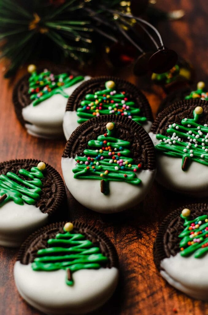 Oreo cookies decorated with icing Christmas trees