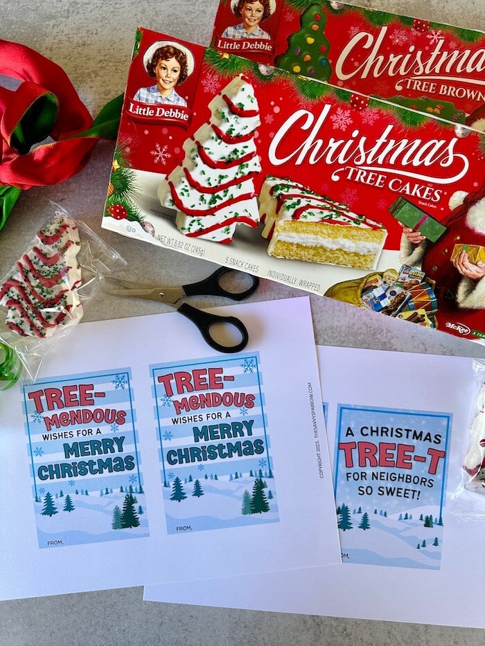 printable Christmas tree cake gift tags, Little Debbie Christmas tree cakes, scissors, and ribbon