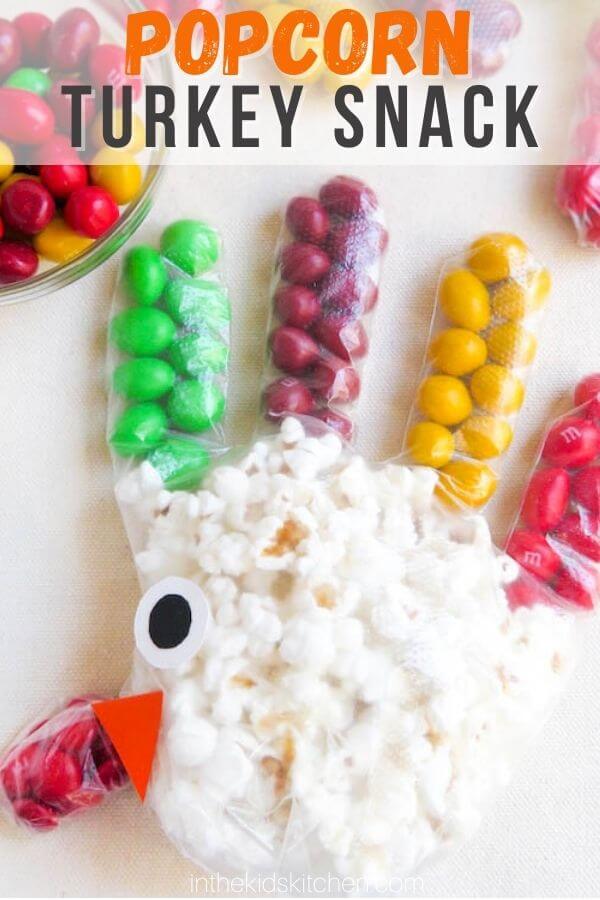 popcorn and candy in a plastic glove to look like a turkey