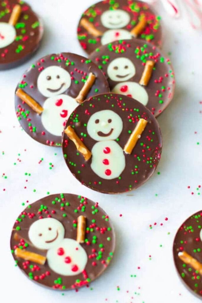 chocolate cups with snowman decorations