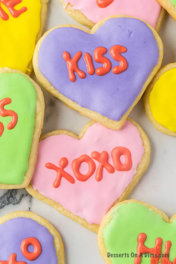 sugar cookies decorated to look like conversation hearts