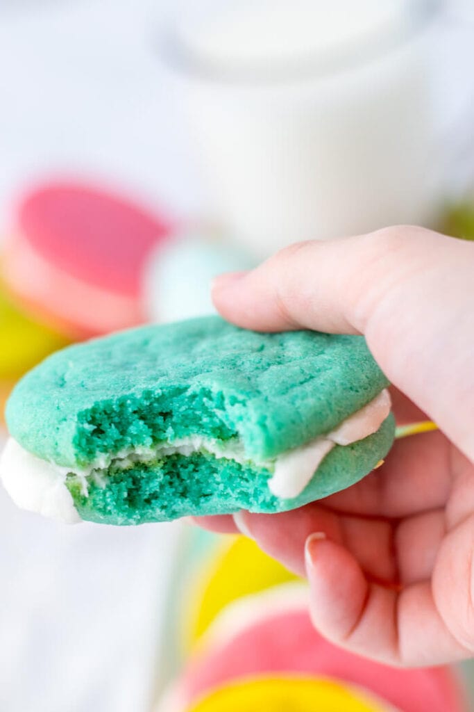 a pastel blue sandwich sugar cookie with buttercream frosting