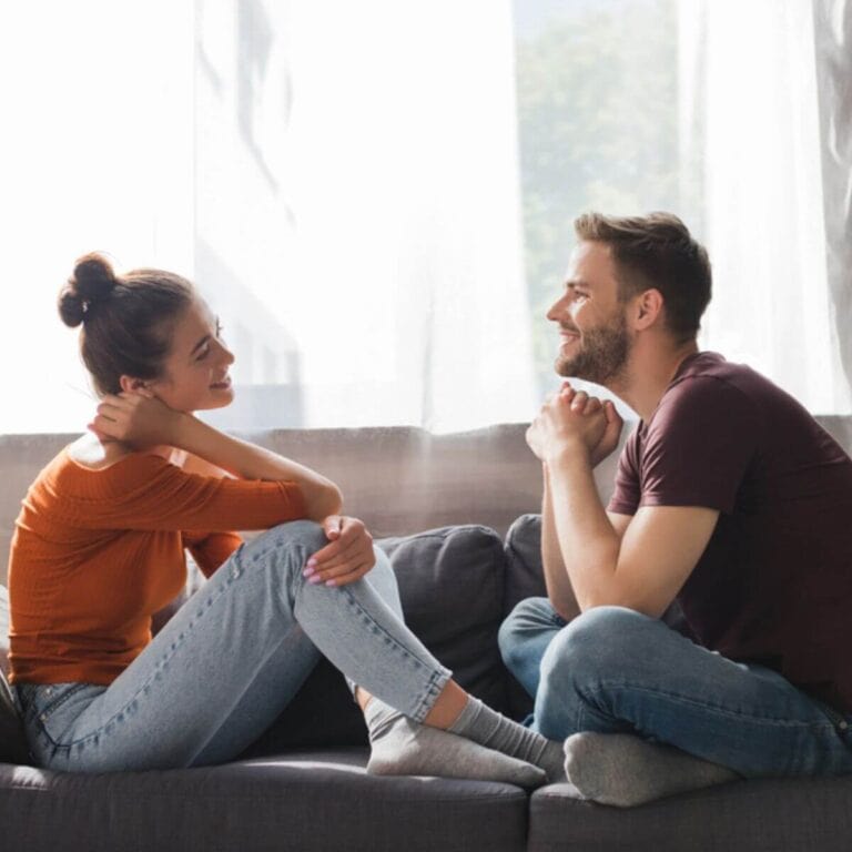 couple spending quality time together talking on a couch