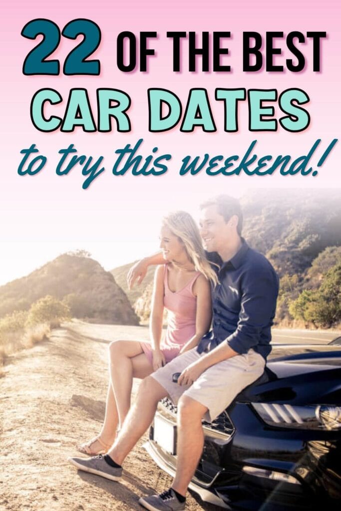 couple sitting on a car and admiring scenery