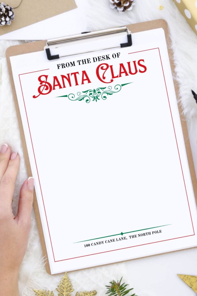 woman using Santa letterhead to write a letter from Santa