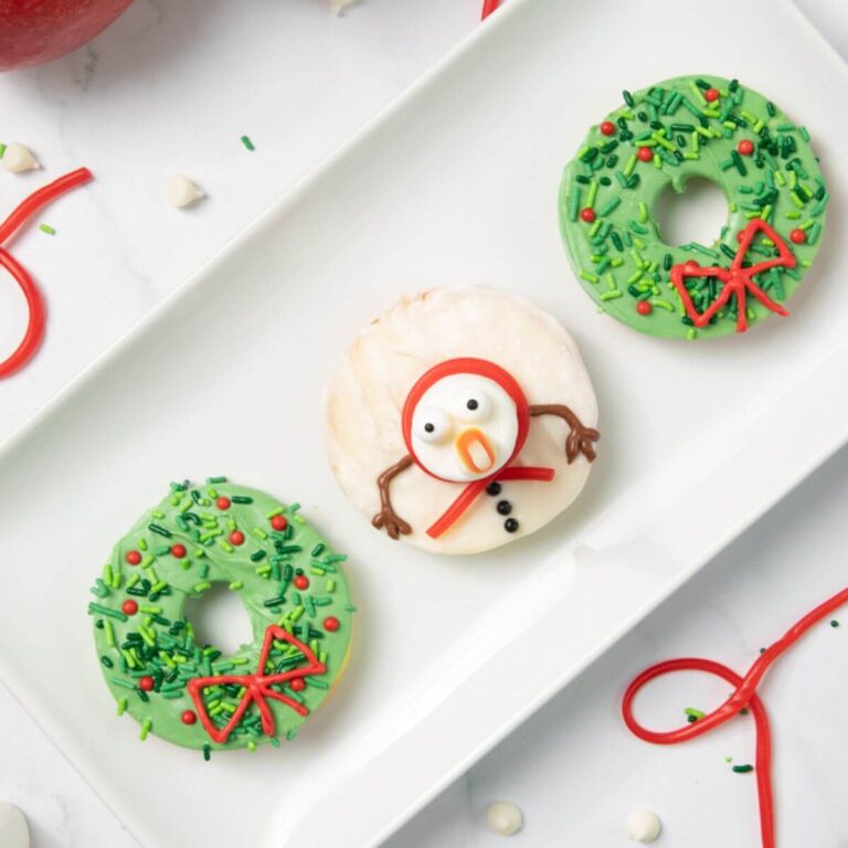 chocolate apple slices decorated like snowman and wreath