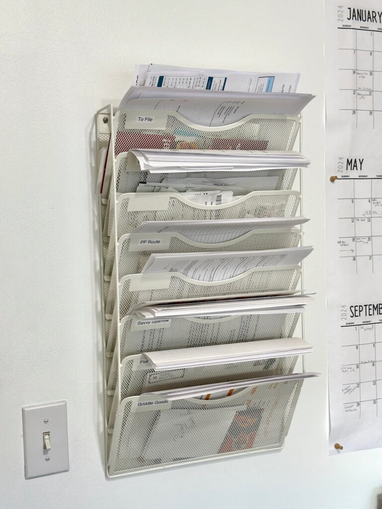 a vertical wall file with home office paperwork