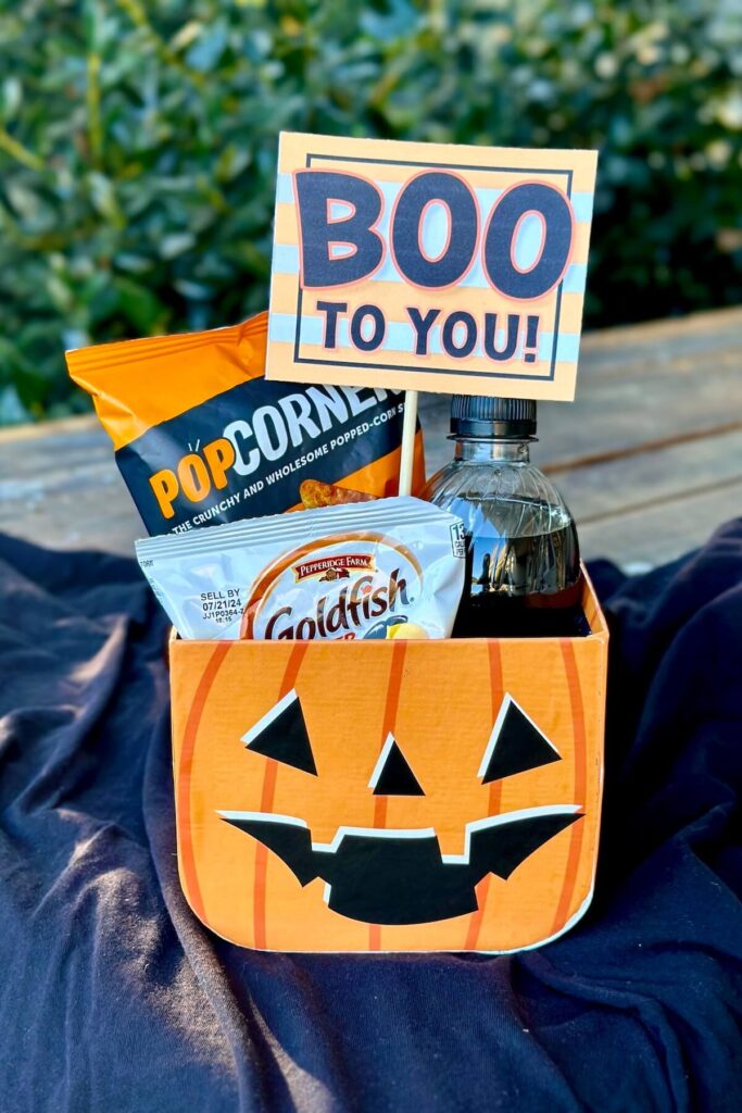 small boo basket with soda and snacks