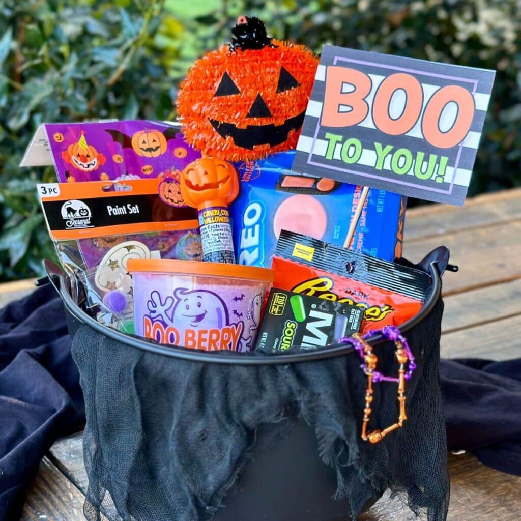 boo basket with Halloween goodies and a printable sign