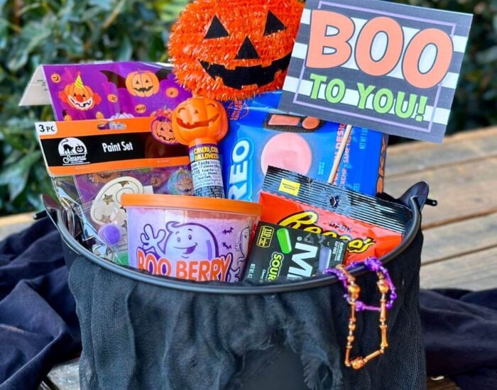 boo basket with Halloween goodies and a printable sign