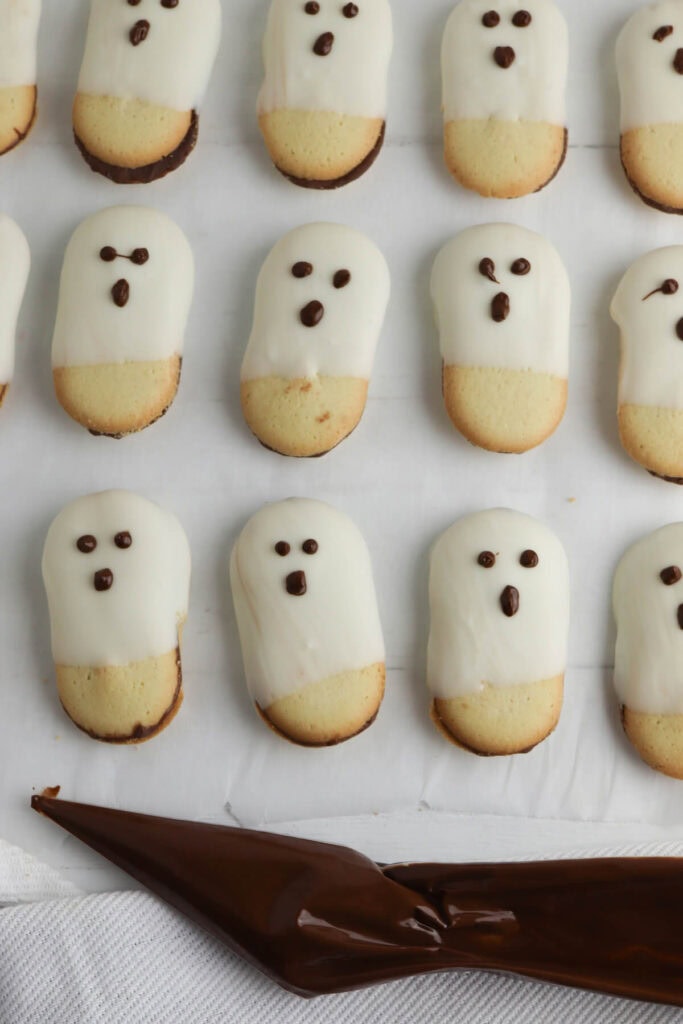 milano cookies dipped in white chocolate to look like ghosts