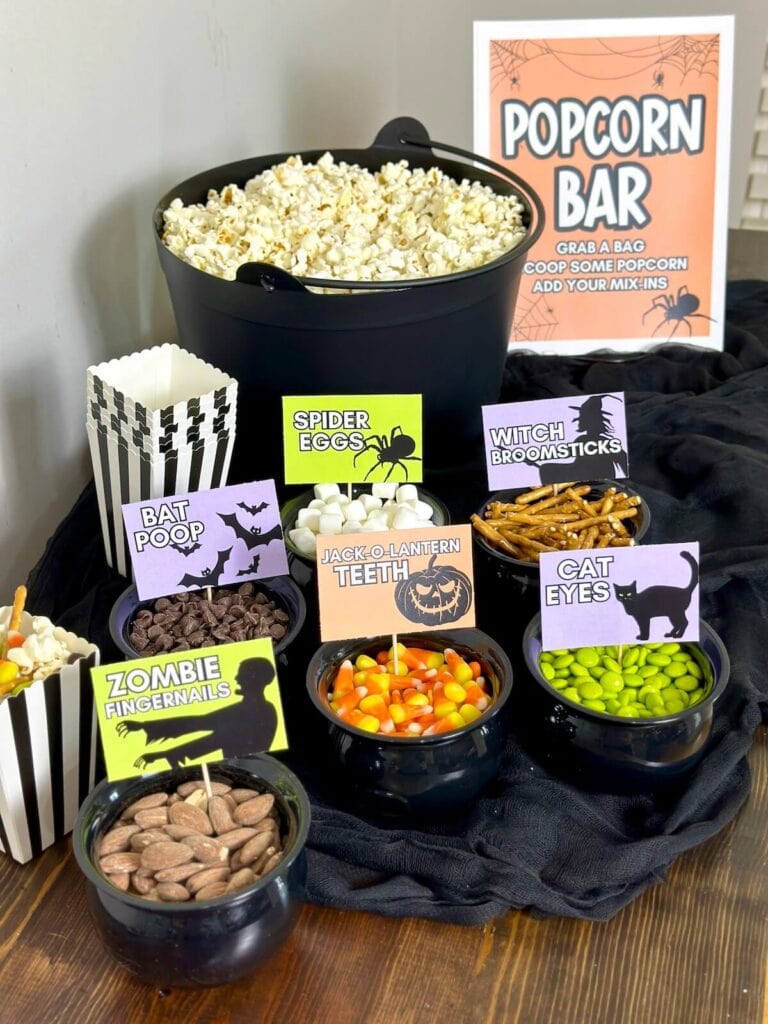 Halloween popcorn bar set up with popcorn mix-ins