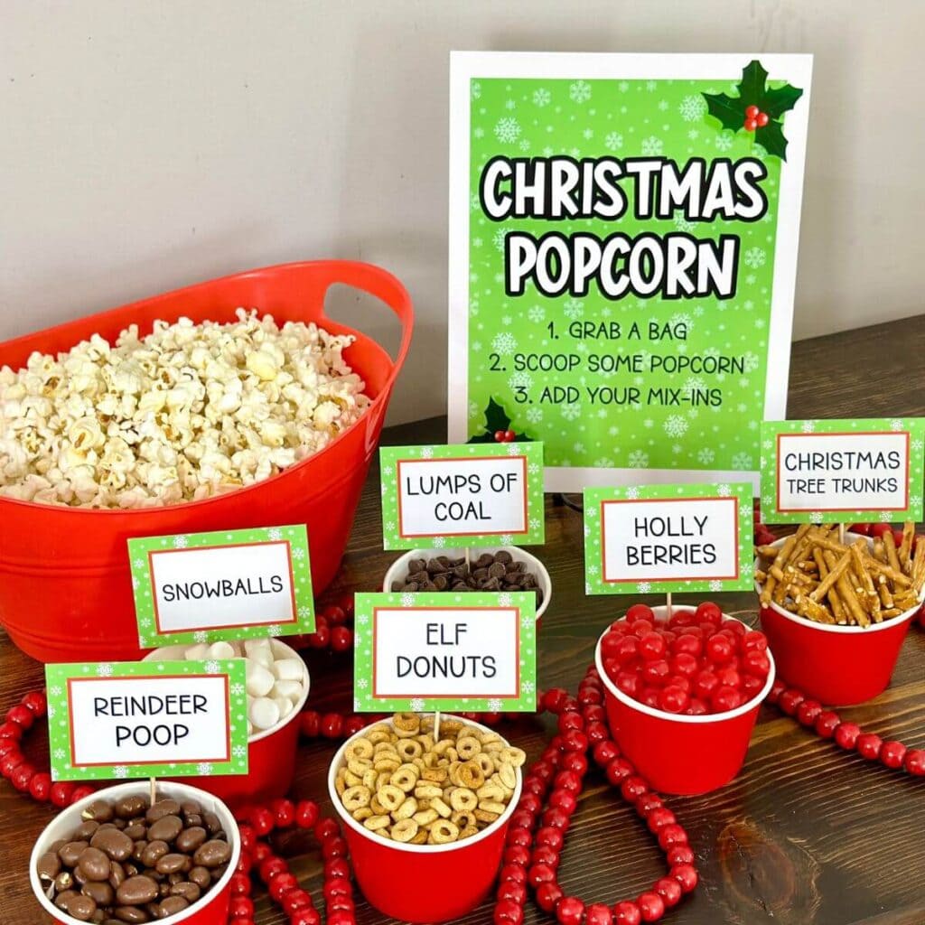 Christmas popcorn bar with mix ins and printable signs