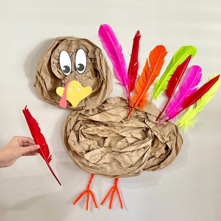 child playing pin the tail on the turkey game