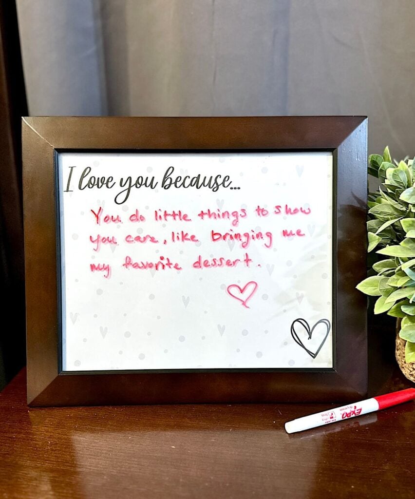 a picture frame with an I love you because sign inside