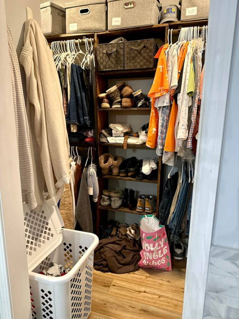 messy master closet with cluttered shoe rack