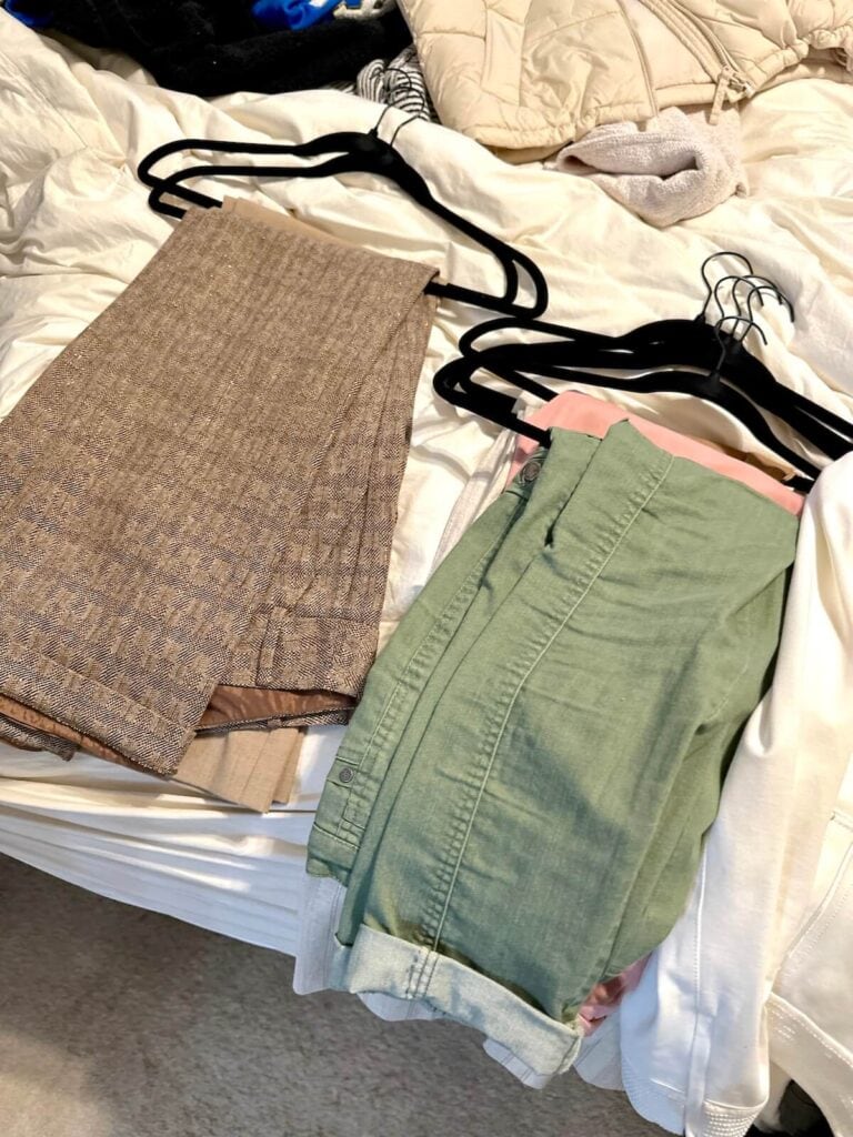 pants hung on black velvet hangers