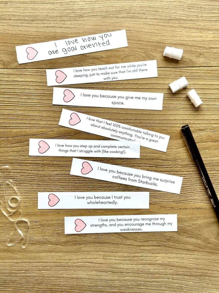 reasons why I love you printed on strips of paper with hearts