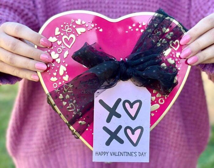 free printable valentine tag that says happy valentine's day tied to a box of chocolate