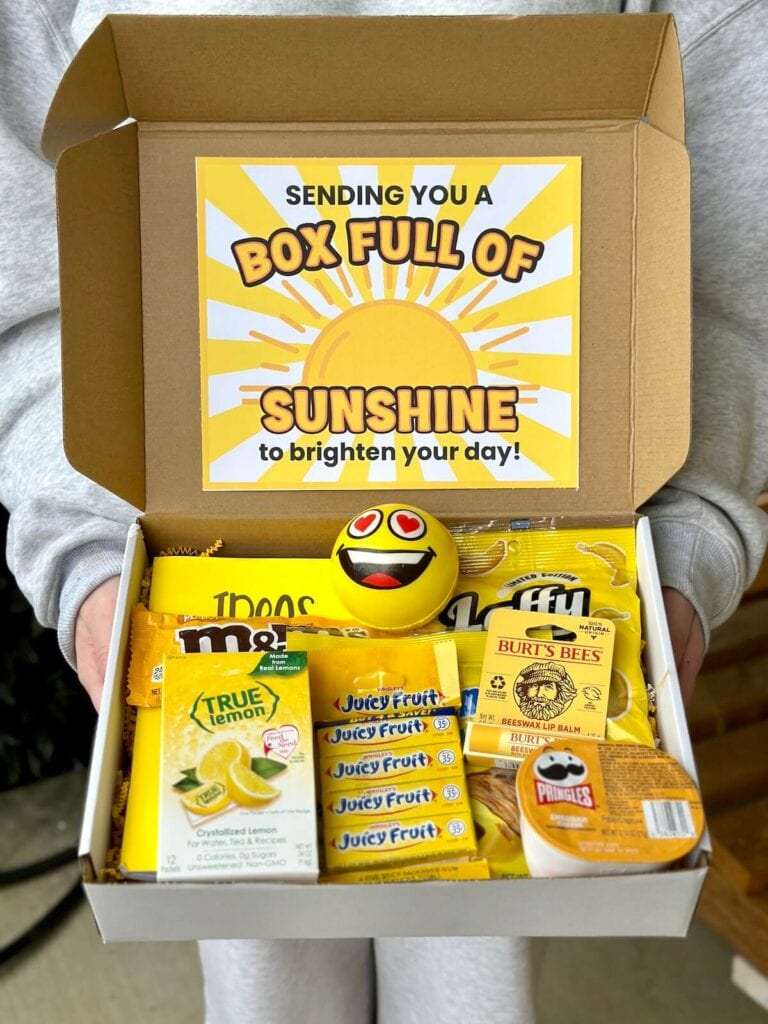 box of sunshine care package with yellow items