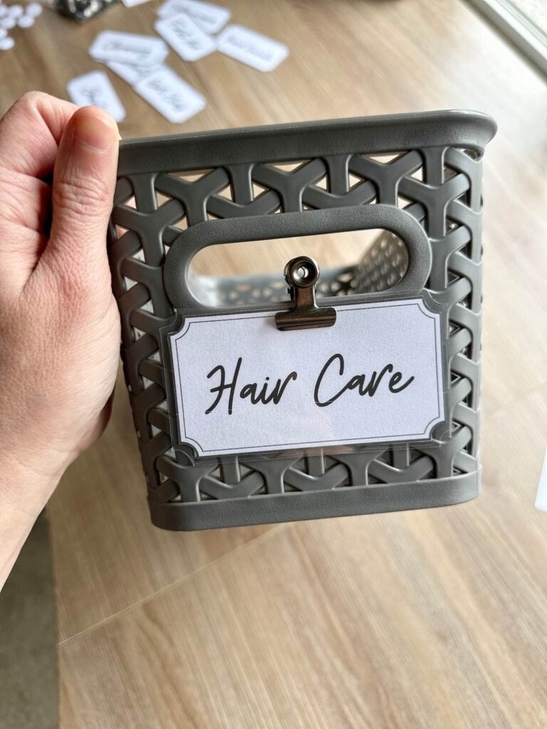 using a decorative clip to attach storage basket label