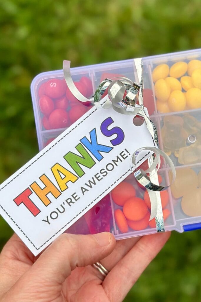 rainbow colored gift tag that says "thanks" on a box of candy