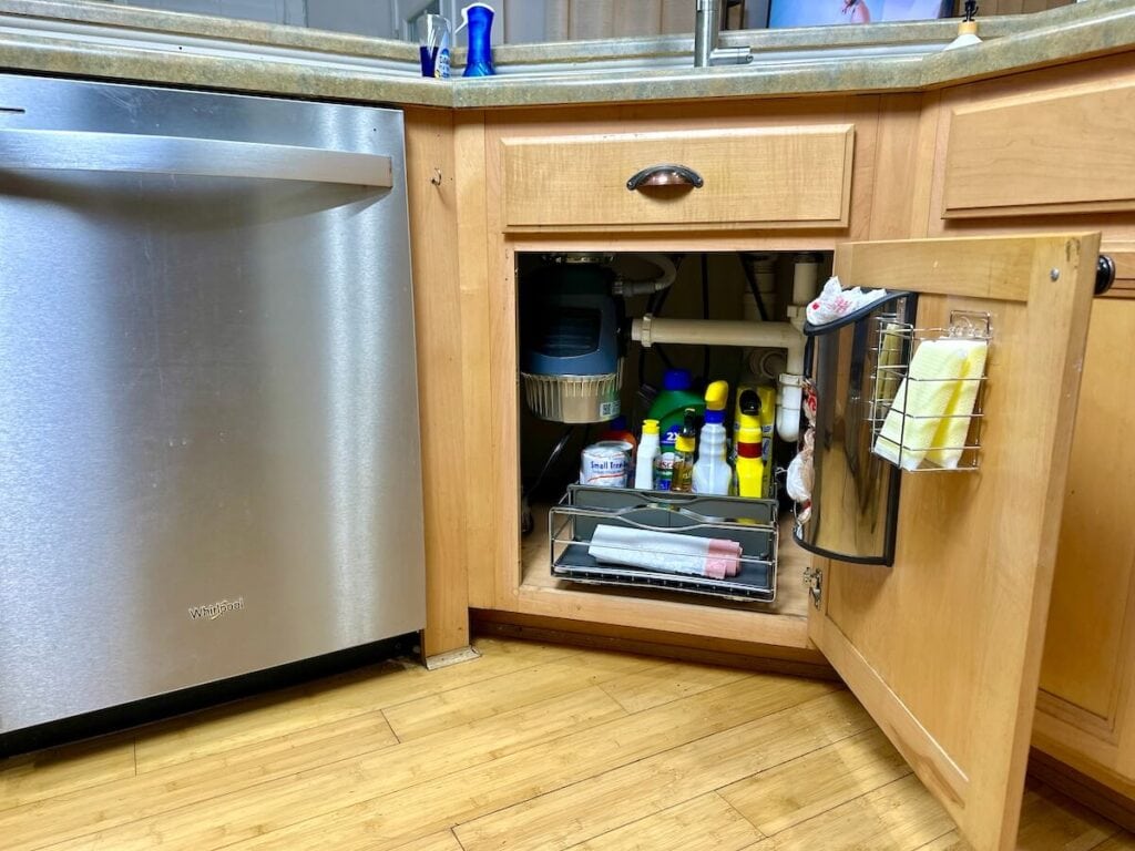 clean and organized cabinet under the kitchen sink