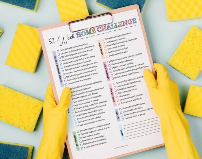 52 week home challenge printable on a clipboard