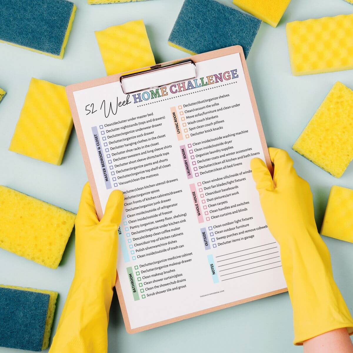 52 week home challenge printable on a clipboard