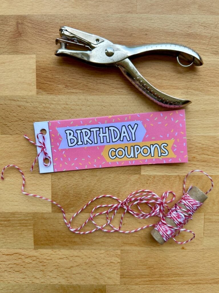 birthday coupon book template put together with a hole punch and twine