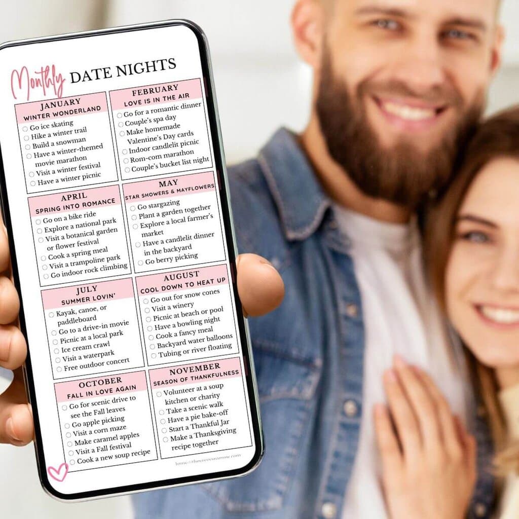 couple holding a phone with a list of monthly themed date night ideas
