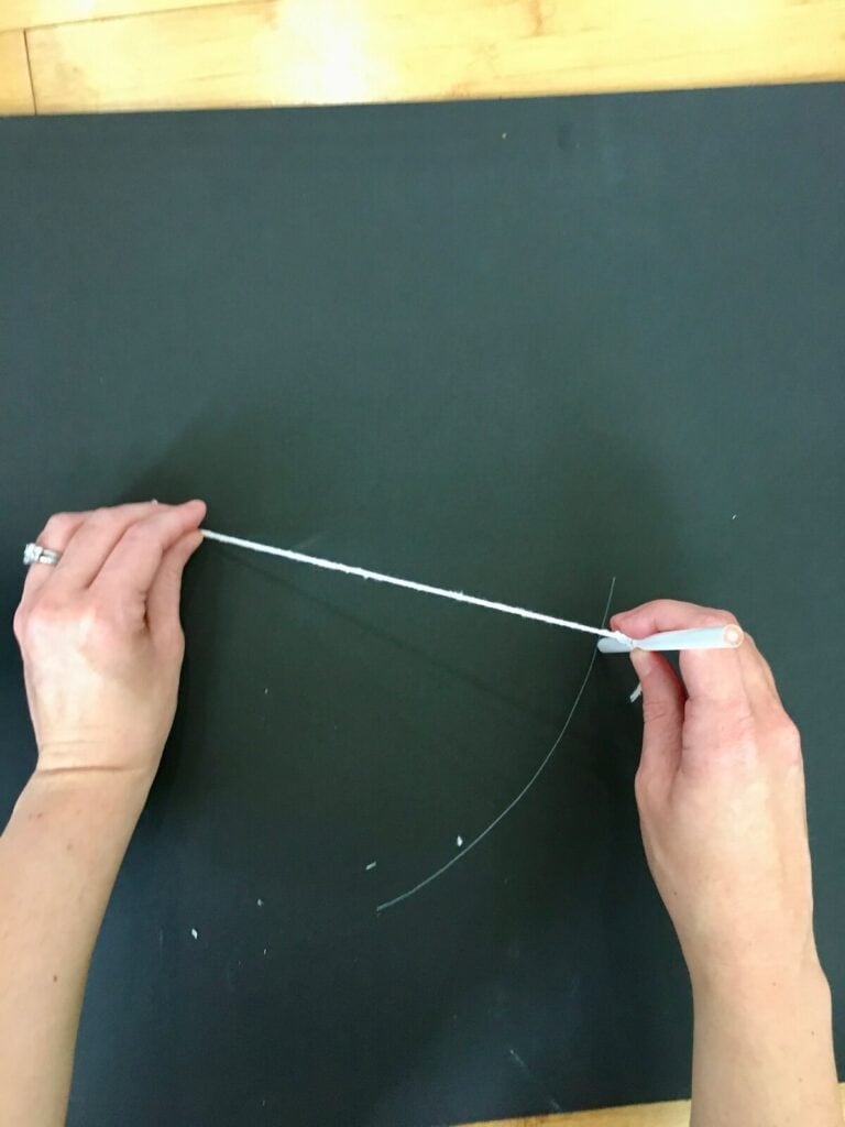 making a round foam board base with a string and a pin