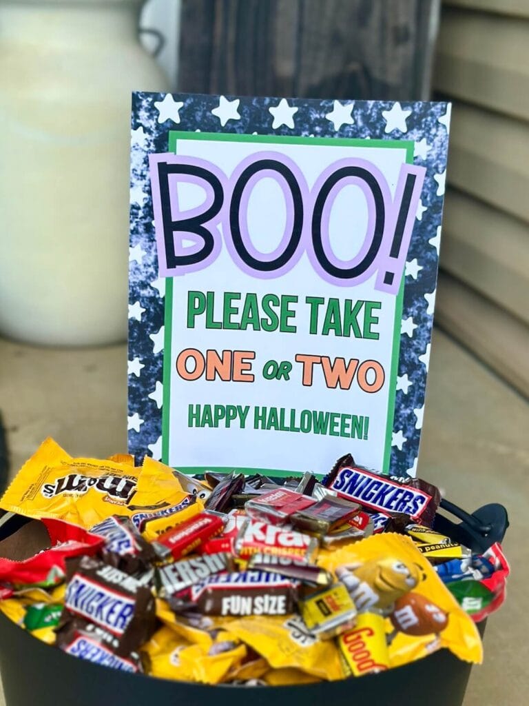 Halloween candy bowl sign that says "boo please take one or two"