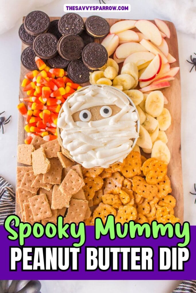 mummy peanut butter dip on a Halloween snack board