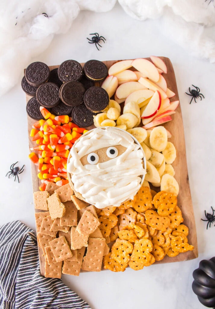 Halloween snack board with peanut butter mummy dip