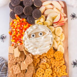 Halloween snack board with peanut butter mummy dip