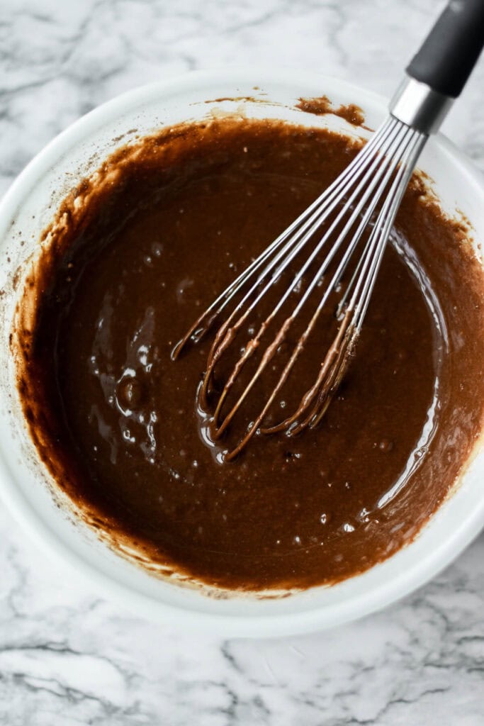 mixing chocolate bundt cake batter