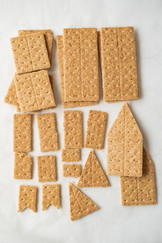 graham crackers cut into different shapes for mini houses