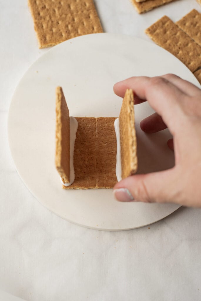 making a gingerbread house out of graham crackers