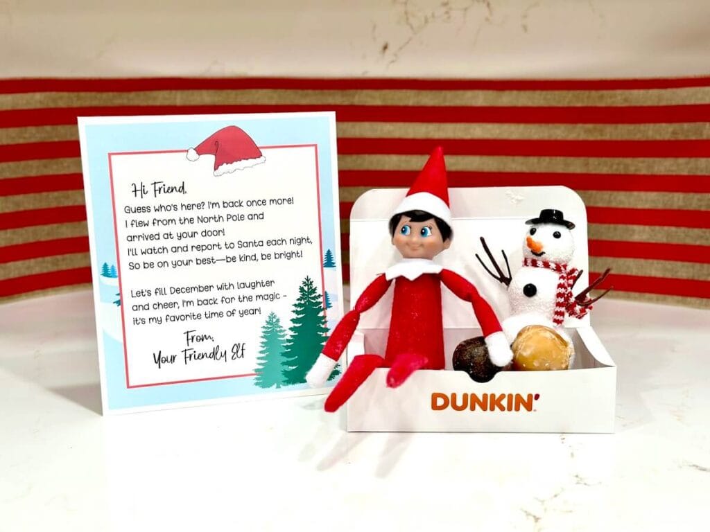 Elf on the Shelf with an arrival letter and donuts