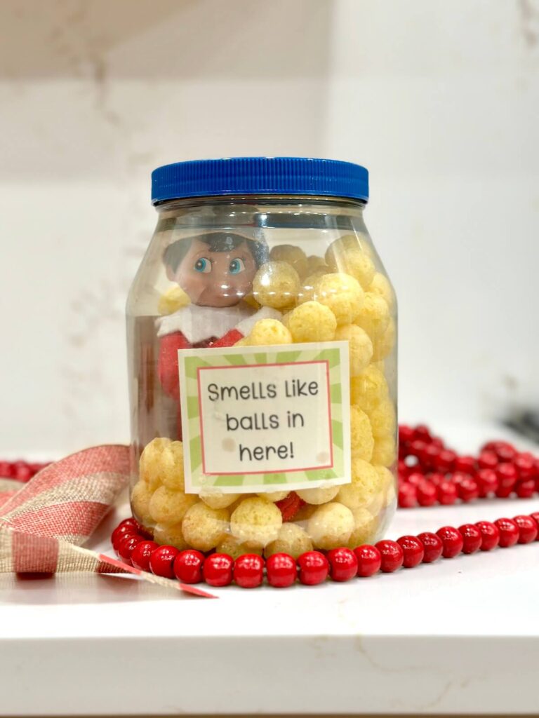 Elf on the Shelf in a jar of cheese balls