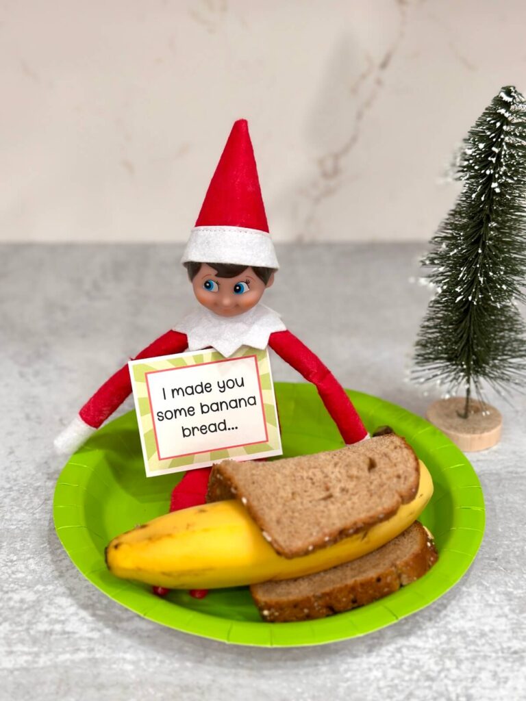 Elf on the shelf making banana bread with a banana and a slice of bread