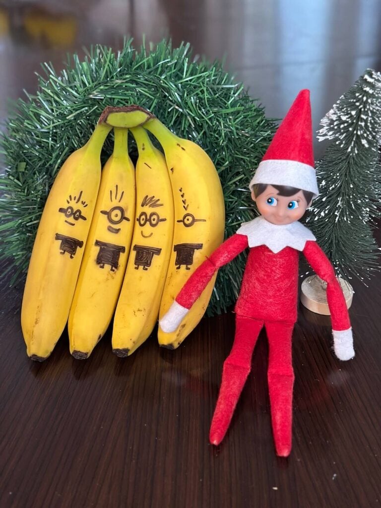 bananas decorated to look like minions with an elf