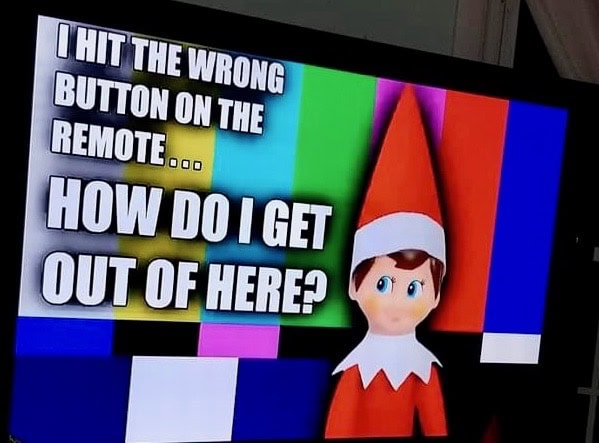 Elf on the Shelf trapped in the TV