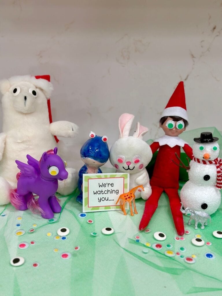 Elf on the Shelf and small figurines and stuffed animals with googly eyes